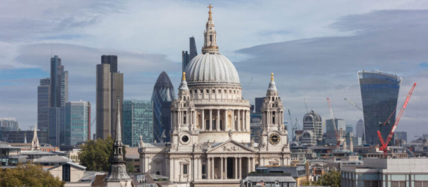 St Paul's Cathedral with the modern buildings of the City of London in the background.